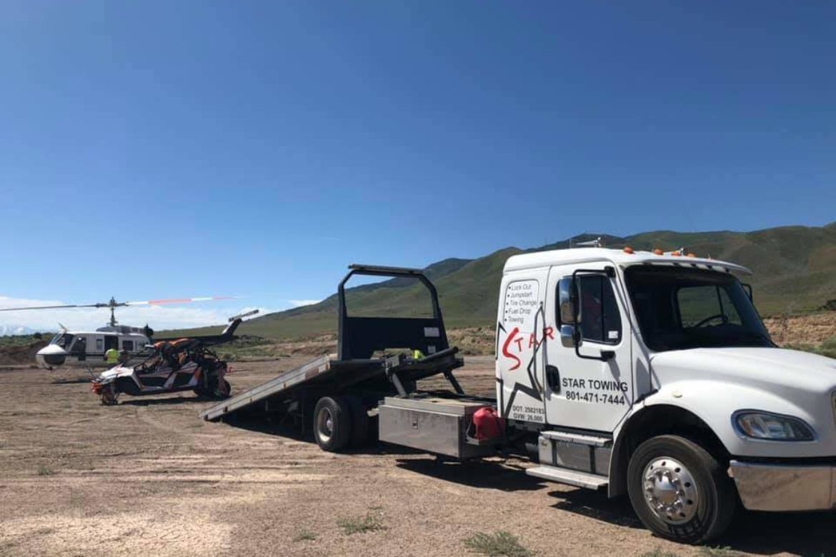 White Lightning with wrecked UTV and Huey Helicopter